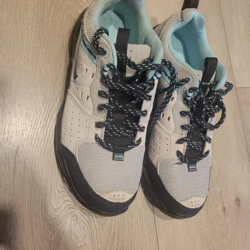 Nike Women's Beige and Black Athletic Shoes with Teal Accents - Picture 2 of 5